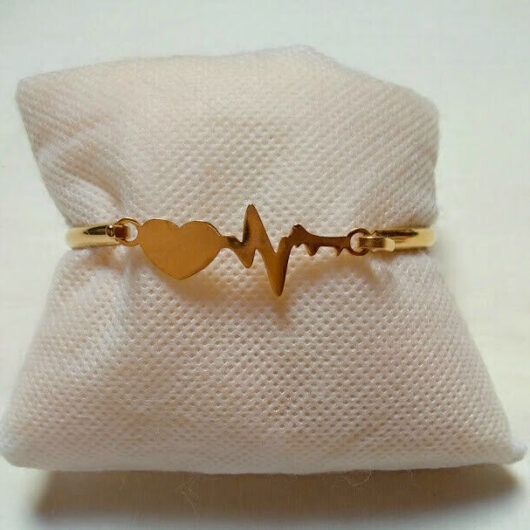 Pulsera acero mujer dorada rígida ritmo cardiaco y cierre nueva