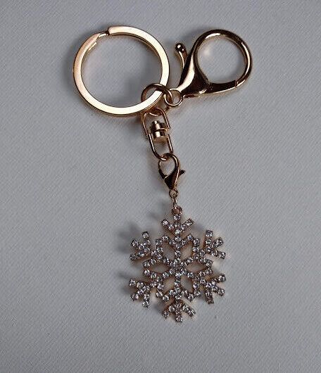 Llavero dorado con símbolo nieve cuajada de similes blancos Nuevo (102)