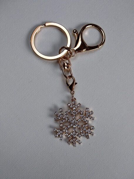 Llavero dorado con símbolo nieve cuajada de similes blancos Nuevo (102)